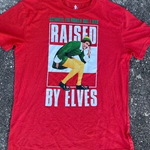 Raised By Elves Christmas Movie red and green t-shirt..